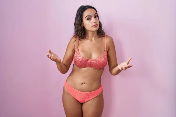 Young Hispanic Woman Wearing Lingerie Pink Background Clueless Confused Open — Stock Photo, Image