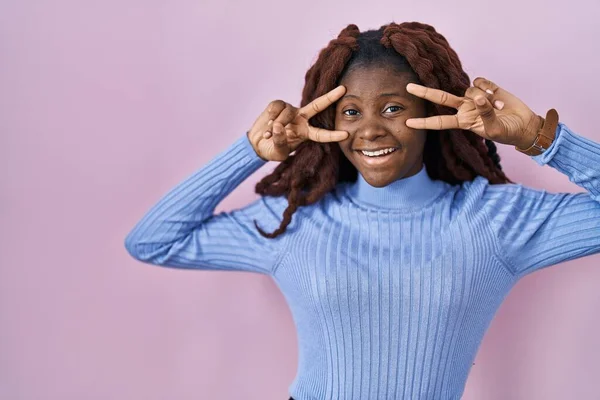 African Woman Standing Pink Background Doing Peace Symbol Fingers Face — Fotografia de Stock