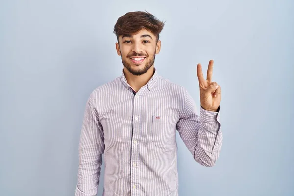 Arab Man Beard Standing Blue Background Showing Pointing Fingers Number — Stockfoto