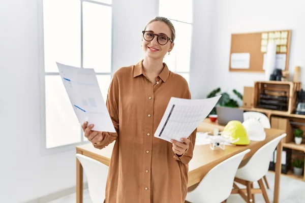 Young Blonde Woman Smiling Confident Holding Project Paperwork Architect Studio — Stockfoto