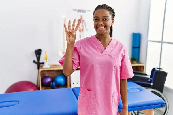 Young African American Woman Working Pain Recovery Clinic Showing Pointing — Stockfoto
