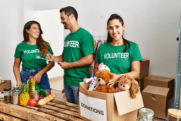 Group Hispanic Volunteers Smiling Happy Working Charity Center — Stock Photo, Image