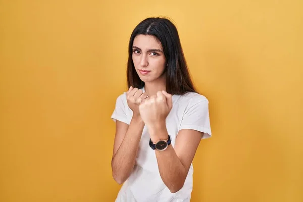 Young Beautiful Woman Standing Yellow Background Ready Fight Fist Defense —  Fotos de Stock