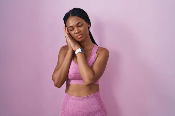African American Woman Braids Wearing Sportswear Pink Background Sleeping Tired — Photo