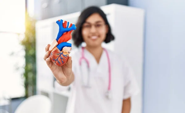 Young Latin Woman Wearing Doctor Uniform Holding Anatomical Model Heart — Stock Photo, Image