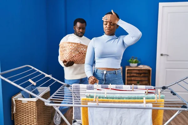 Young African American Couple Hanging Clothes Clothesline Stressed Frustrated Hand — Stock Photo, Image
