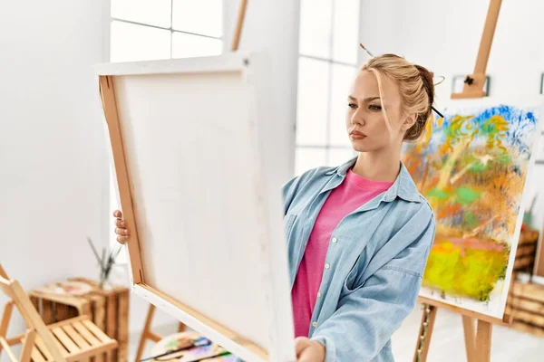 stock image Young caucasian woman artist looking draw at art studio