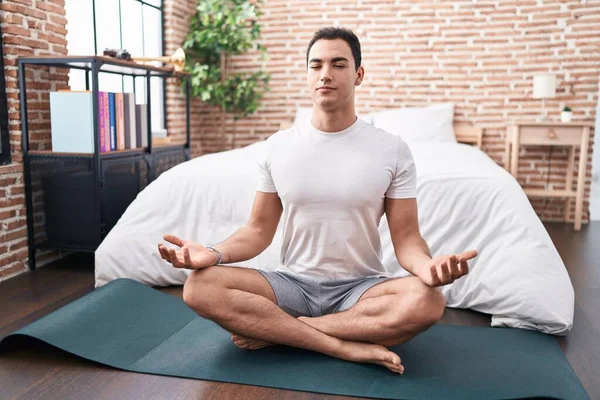 Young Hispanic Man Doing Yoga Exercise Sitting Floor Bedroom — Stockfoto