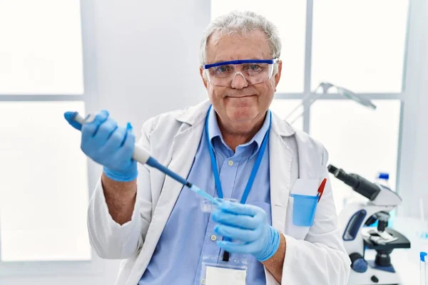 Middle Age Grey Haired Man Wearing Scientist Uniform Using Pipette — Stock Photo, Image