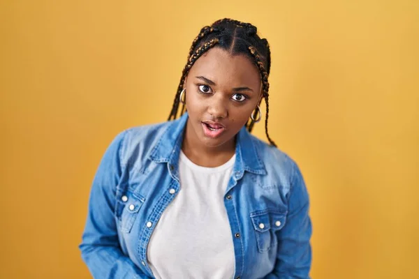 African American Woman Braids Standing Yellow Background Shock Face Looking — Stockfoto