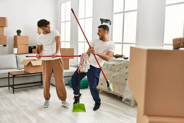 Two Hispanic Men Couple Cleaning Dancing New Home — Stock Photo, Image