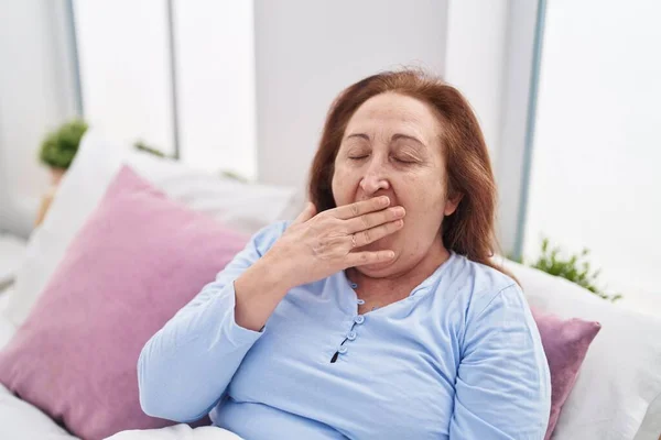 Senior Woman Sitting Bed Yawning Bedroom — Fotografia de Stock