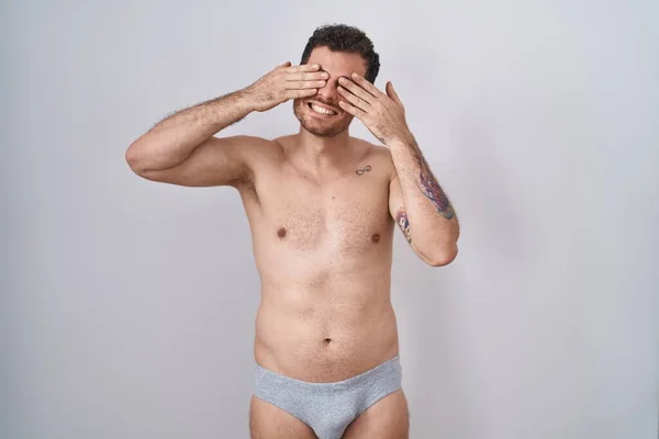 Young Hispanic Man Standing Shirtless Wearing Underware Covering Eyes Hands — Stock Photo, Image
