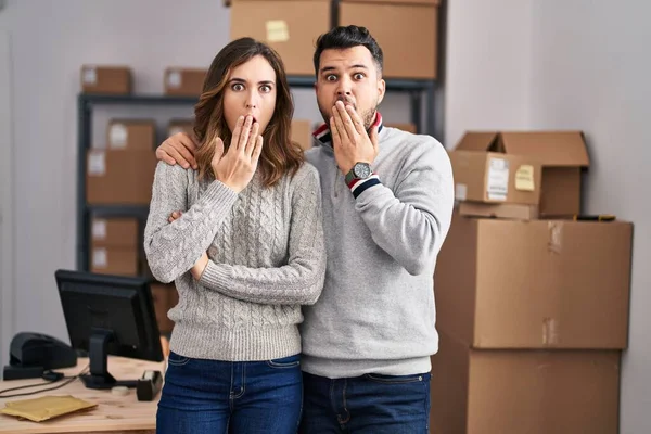Young Hispanic Couple Working Small Business Ecommerce Covering Mouth Hand — Stockfoto