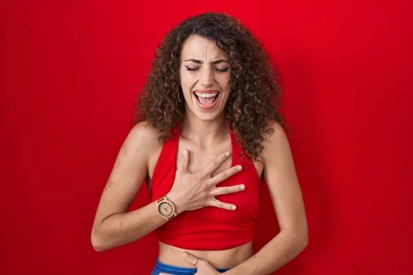 Hispanic Woman Curly Hair Standing Red Background Smiling Laughing Hard — Photo