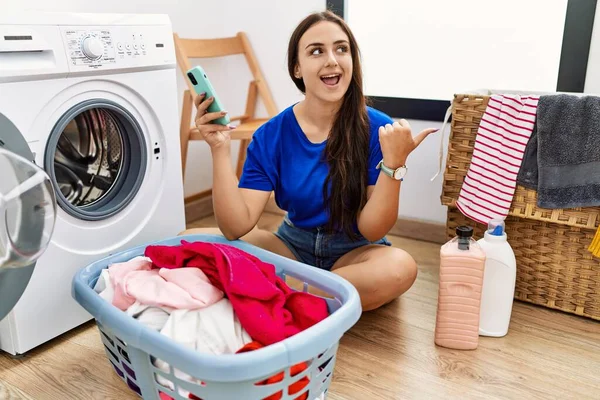Young Brunette Woman Doing Laundry Using Smartphone Smiling Happy Face — Stock Photo, Image