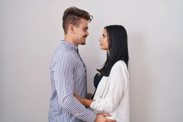 Young Hispanic Couple Standing White Background Looking Side Relax Profile — ストック写真