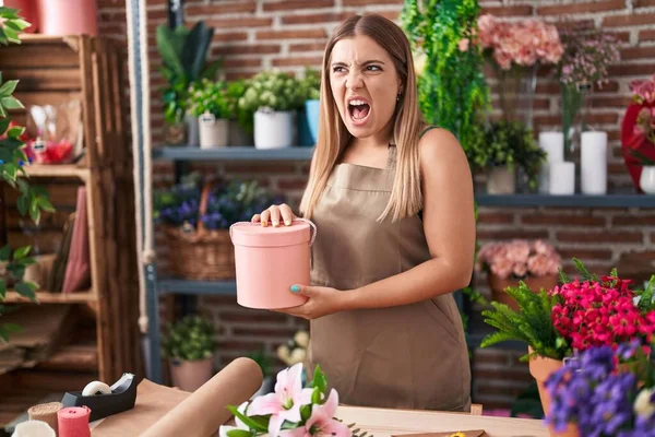 Young Blonde Woman Working Florist Shop Angry Mad Screaming Frustrated — Stockfoto