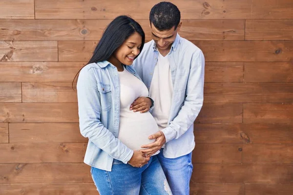 Young Latin Couple Expecting Baby Touching Belly Street — Zdjęcie stockowe
