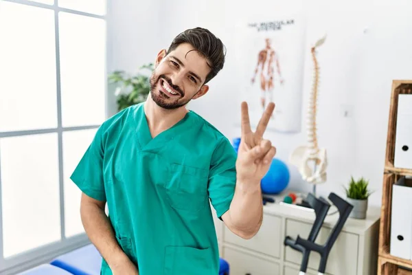 Young Man Beard Working Pain Recovery Clinic Smiling Looking Camera — Stok fotoğraf