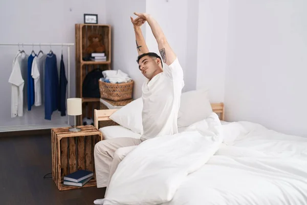 Young Hispanic Man Waking Stretching Arms Bedroom — Photo