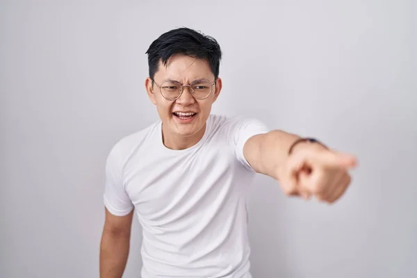 Young Asian Man Standing White Background Pointing Displeased Frustrated Camera — Stok fotoğraf