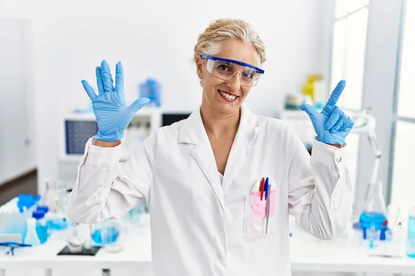 Middle Age Blonde Woman Working Scientist Laboratory Showing Pointing Fingers — Stock Photo, Image