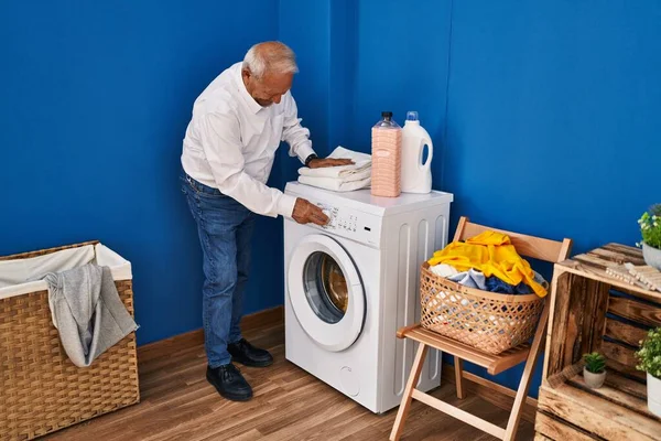 Senior Man Turning Washing Machine Laundry Room — Stockfoto