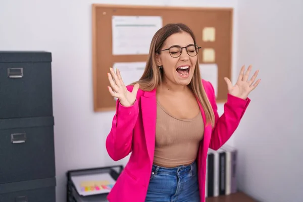 Young Blonde Woman Standing Office Celebrating Mad Crazy Success Arms — Stockfoto