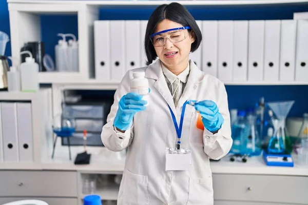 Young Asian Woman Working Scientist Laboratory Winking Looking Camera Sexy — Stockfoto