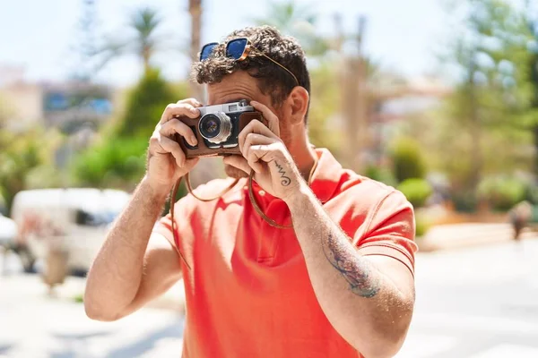 Young Hispanic Man Tourist Using Vintage Camera Street — Stockfoto