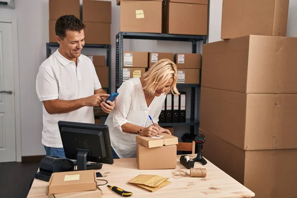 Middle Age Man Woman Business Partners Using Smartphone Working Storehouse — Stock Photo, Image