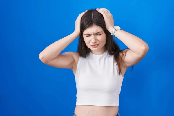Young Caucasian Woman Standing Blue Background Suffering Headache Desperate Stressed — Stock Photo, Image