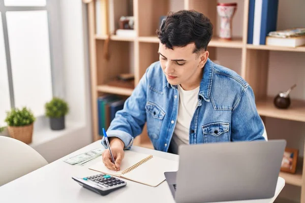Young Non Binary Man Sitting Table Doing Accounting Home — Zdjęcie stockowe