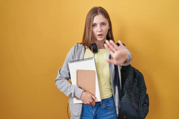 Young Caucasian Woman Wearing Student Backpack Holding Books Doing Stop — Φωτογραφία Αρχείου