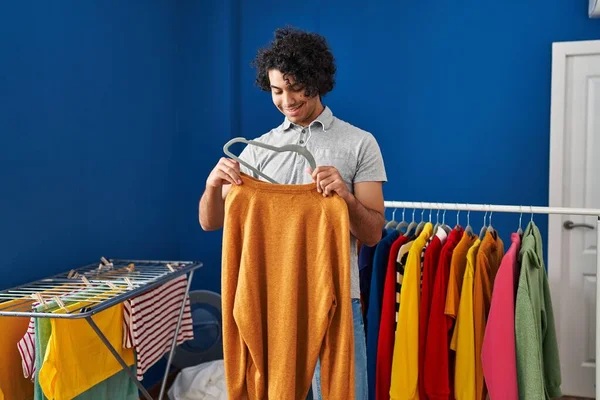 Young Hispanic Man Smiling Confident Hanging Clothes Rack Laundry Room — Fotografia de Stock