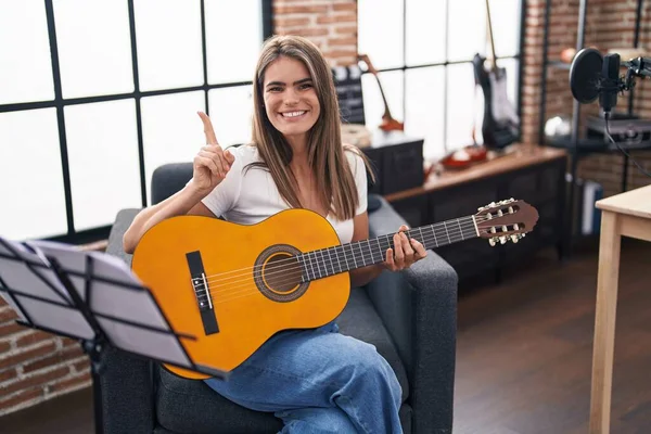 Young Beautiful Woman Playing Classic Guitar Music Studio Smiling Happy — Fotografia de Stock