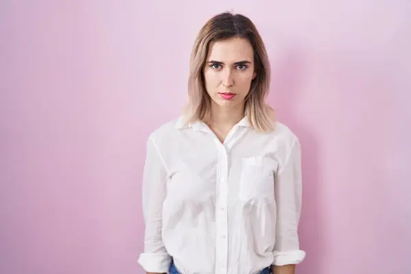 Young Beautiful Woman Standing Pink Background Skeptic Nervous Frowning Upset — Stockfoto
