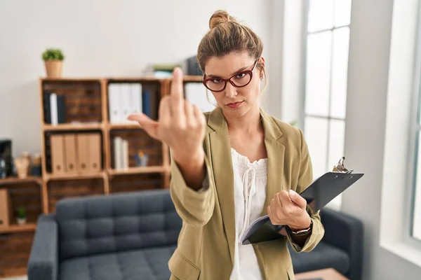 Young Woman Working Consultation Office Showing Middle Finger Impolite Rude – stockfoto
