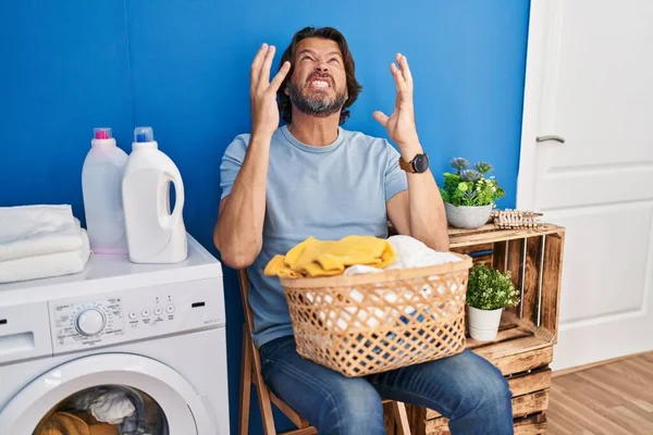 Handsome Middle Age Man Waiting Laundry Crazy Mad Shouting Yelling — Stock Photo, Image