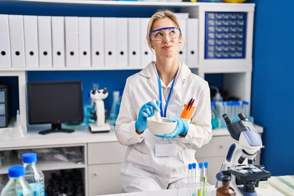 Young Caucasian Woman Working Scientist Laboratory Smiling Looking Side Staring — Stockfoto