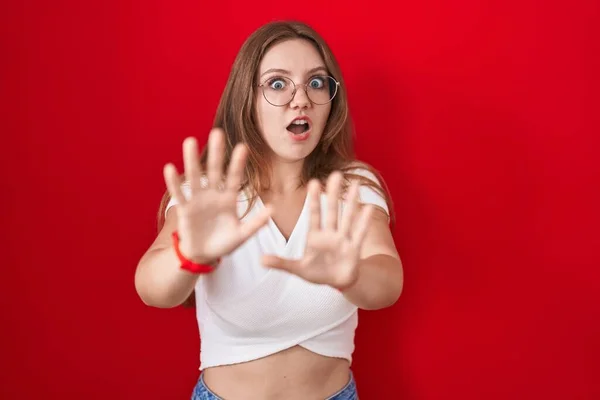 Young Caucasian Woman Standing Red Background Afraid Terrified Fear Expression — Stock Photo, Image