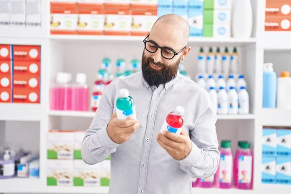 Young Bald Man Customer Smiling Confident Holding Medication Bottles Pharmacy — Stock Photo, Image