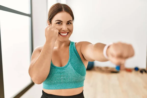 stock image Young beautiful hispanic woman smiling confident boxing at sport center