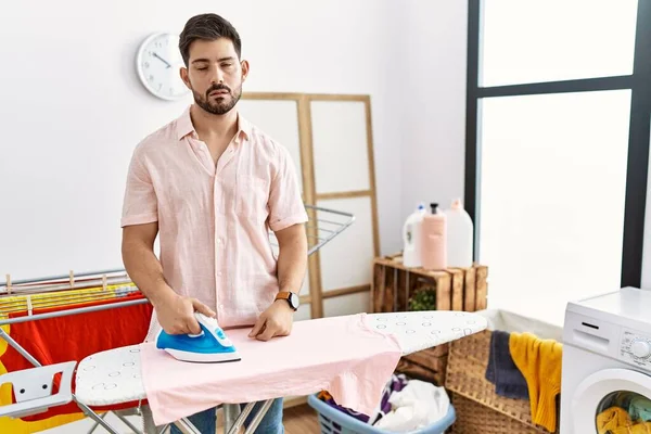 Young Man Beard Ironing Clothes Home Looking Sleepy Tired Exhausted — Foto Stock