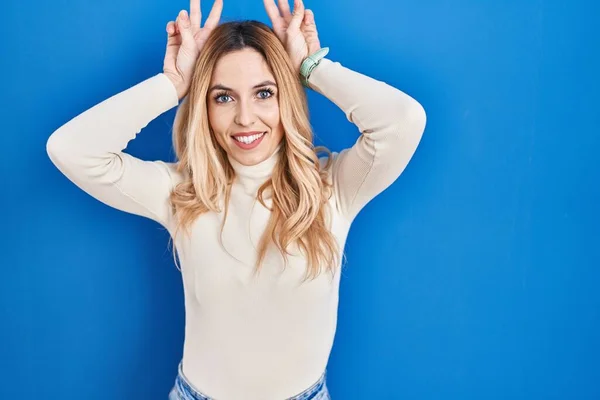Young Caucasian Woman Standing Blue Background Posing Funny Crazy Fingers — Foto Stock