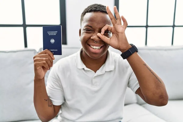 Young African Man Holding Deutschland Passport Smiling Happy Doing Sign — Foto Stock