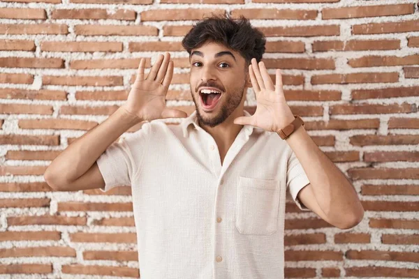 Arab Man Beard Standing Bricks Wall Background Smiling Cheerful Playing — Foto Stock