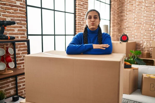 Young Hispanic Woman Moving New Home Puffing Cheeks Funny Face — Fotografia de Stock