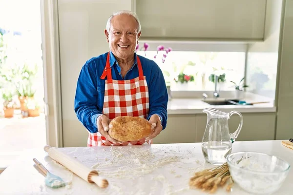 Senior Man Smiling Confident Holding Homemade Bread Kitchen — Stock Photo, Image